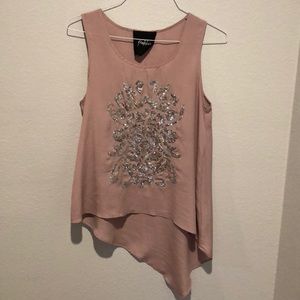 Blush handkerchief hem top with silver accent